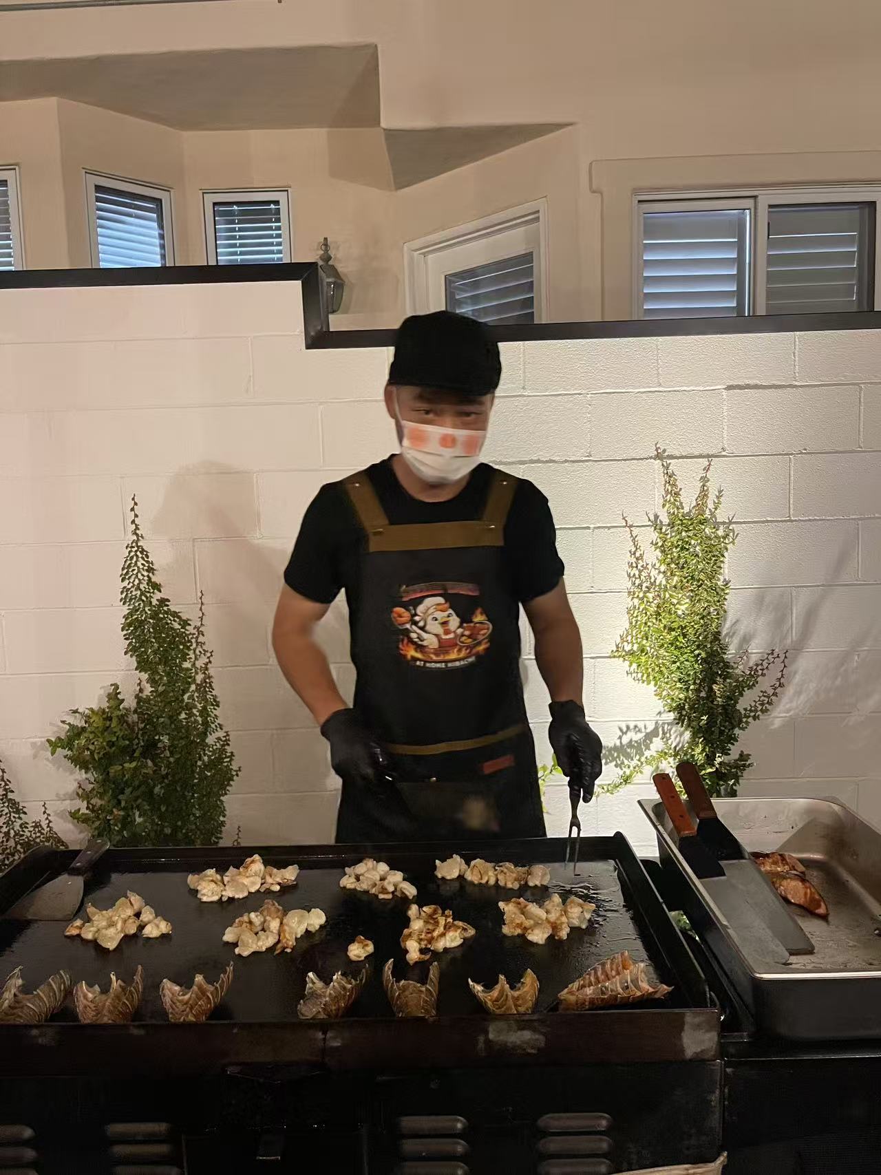 Sizzle Yard chef cooking lobster on the hibachi grill