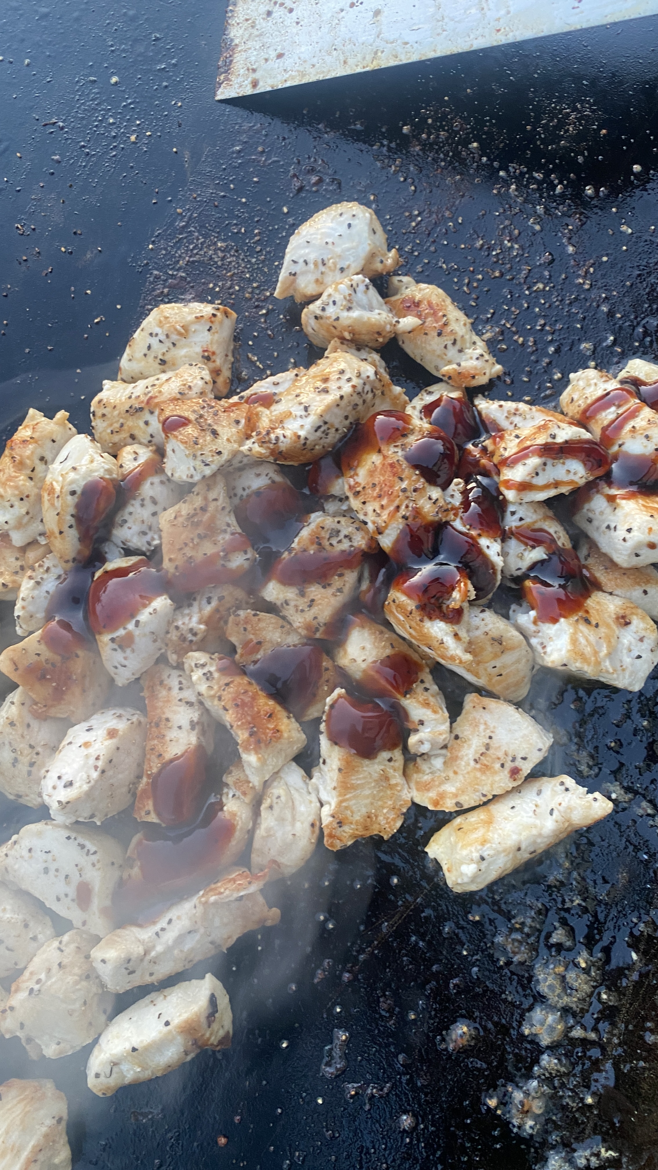 Chicken cooking on a real Sizzle Yard hibachi grill